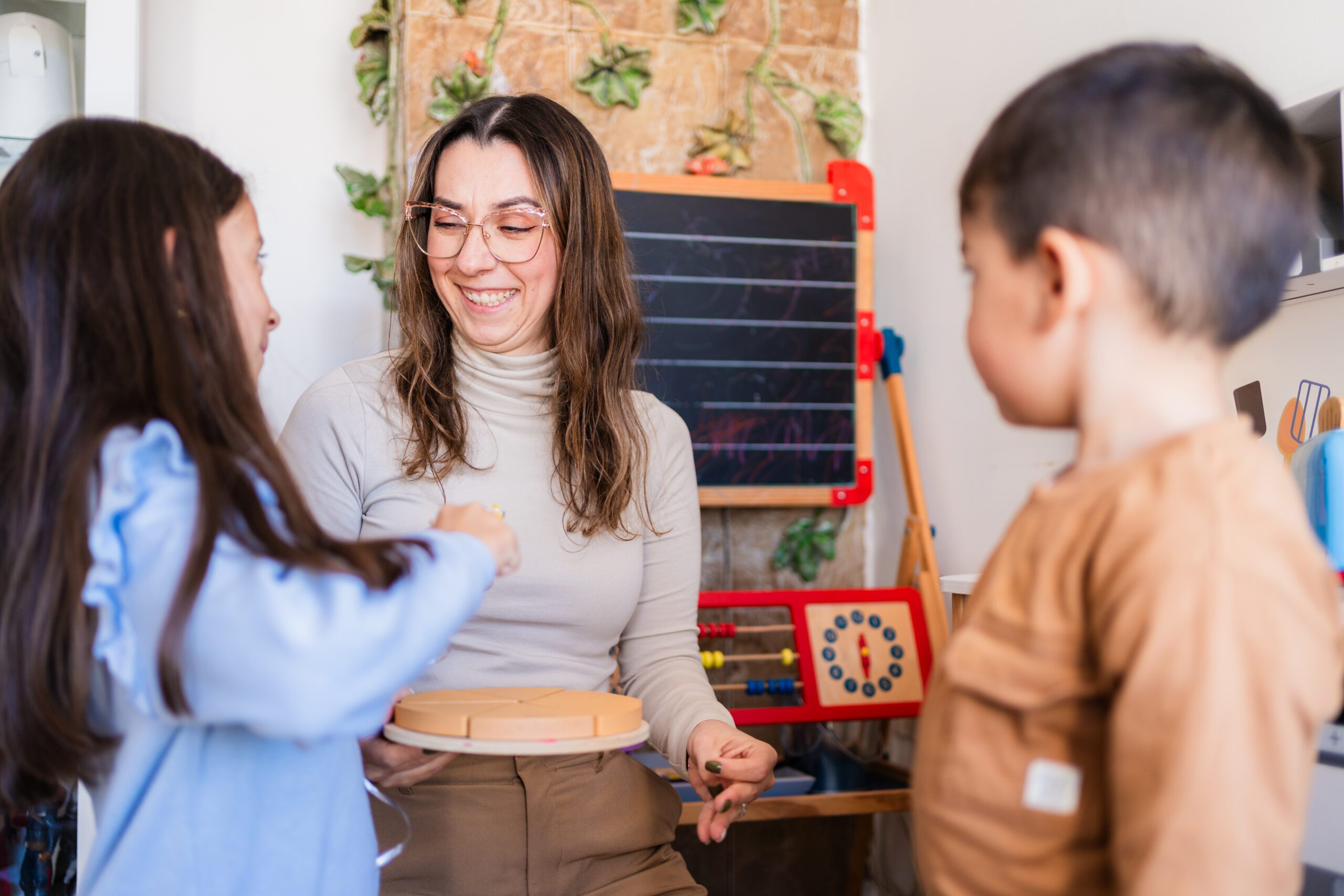 Teacher and students learning fractions using fraction circles in a montessori classroom Woman teaching children with puzzle game at home