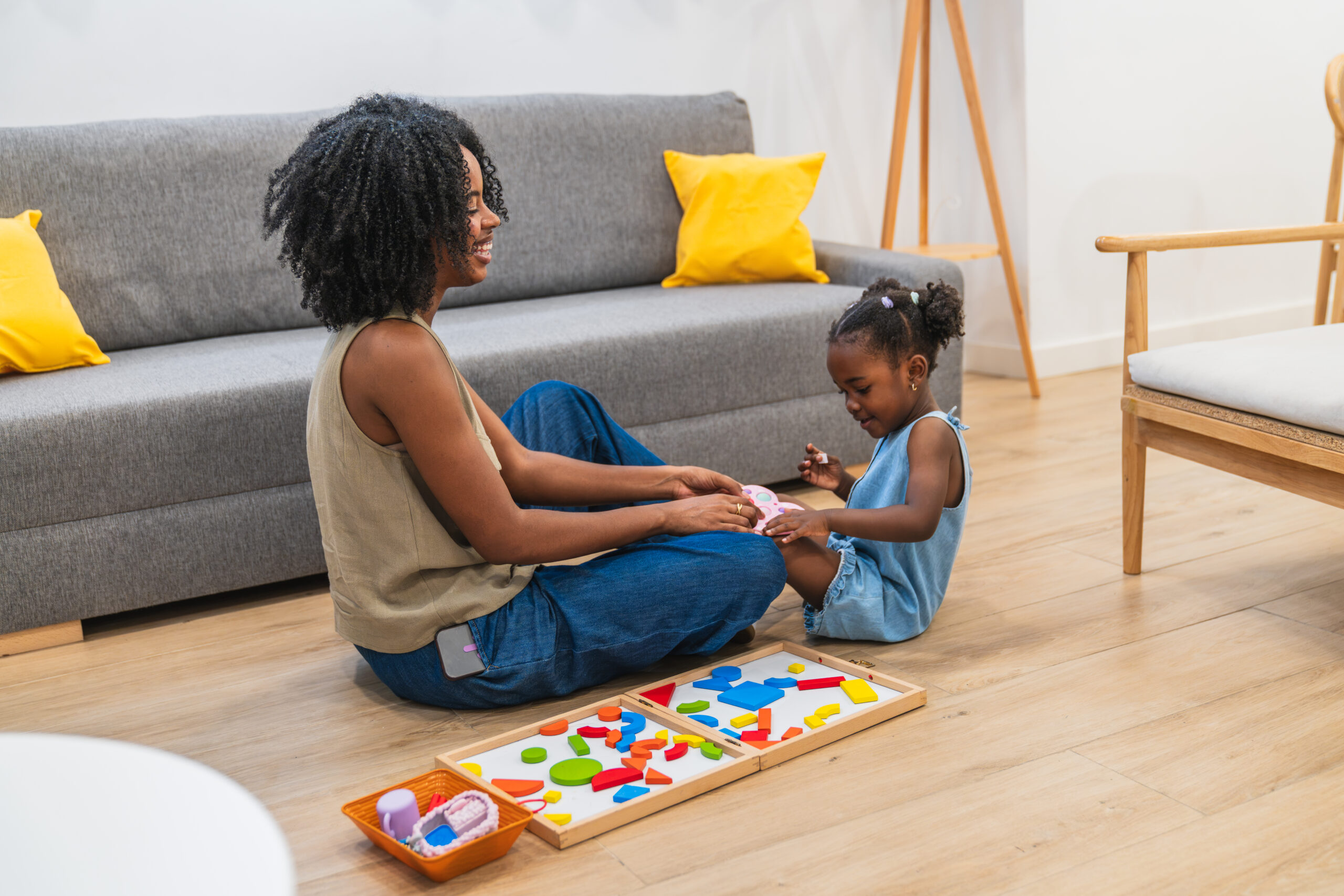 African american mother and daughter bonding playing at home